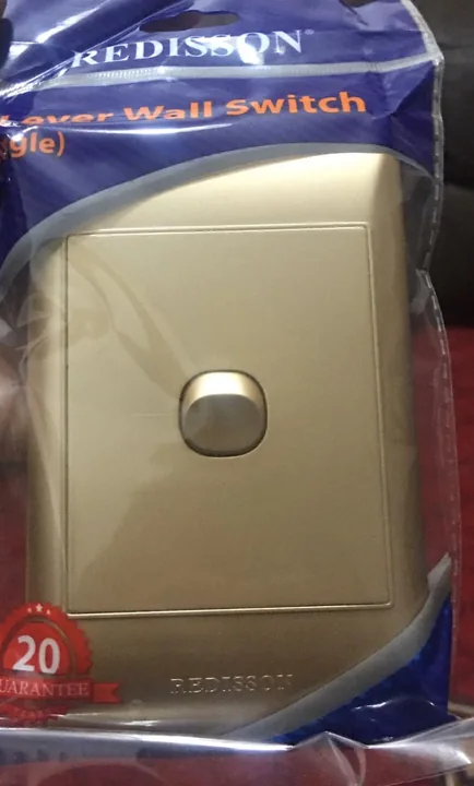 Gold wall switch in the illustrative storefront